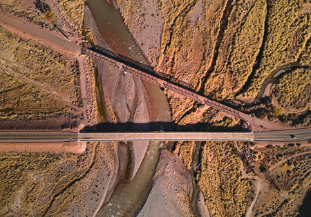 Bridge across Mendoza River by the Andes mountains near Uspallata, Argentina. Aerial view.の写真素材