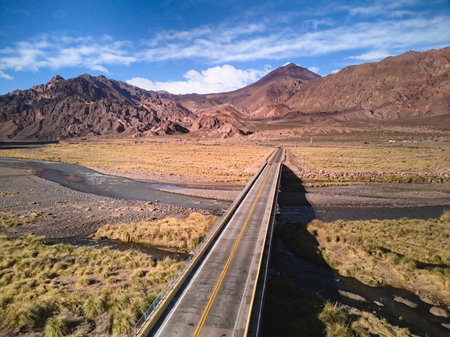 Bridge across Mendoza River by the Andes mountains near Uspallata, Argentina.の写真素材