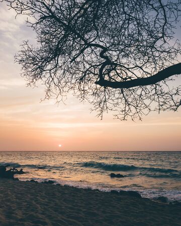 sunset at white beach in colombian islandの写真素材