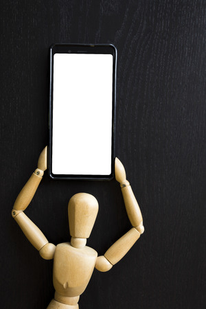 Wooden Figure Manikin Human Artist Draw Painting wood doll holding a mobile phoneの写真素材