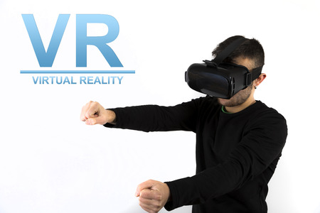 Bearded Young man with modern glasses with virtual glasses isolated on white backgroundの写真素材