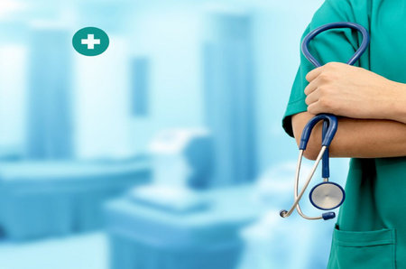 Doctor with stethoscope on blurred hospital background. Medical and healthcare conceptの写真素材