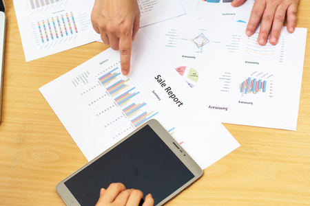 Business man working at office with phone.tablet and graph dataの写真素材