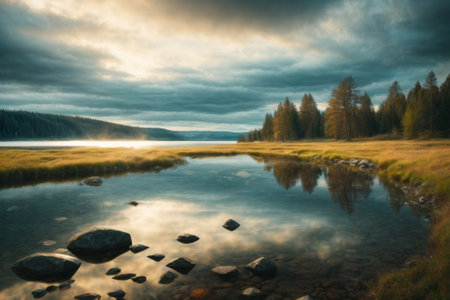 Mountain lake in the evening. Long exposure photo. Dramatic sky.の素材