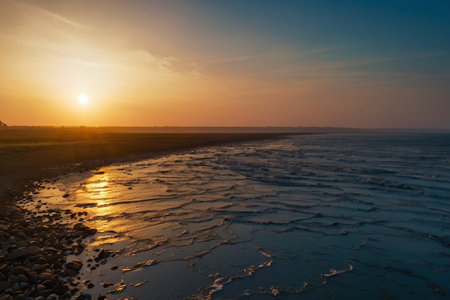 Sunset on the beach of the Baltic Sea in Kolobrzeg, Polandの素材