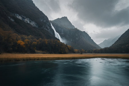 Autumn landscape with a view of the waterfall in the mountains.の素材