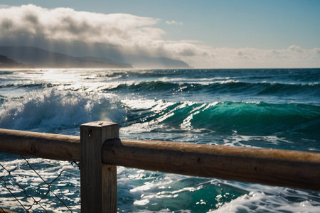 View of the sea from a wooden fence. Waves and water splashes.の素材