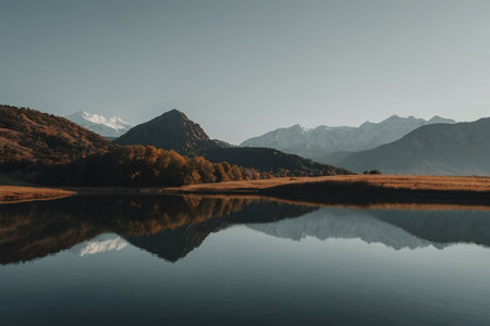 Mountains reflected in the lake. Beautiful autumn landscape in the mountains.の素材