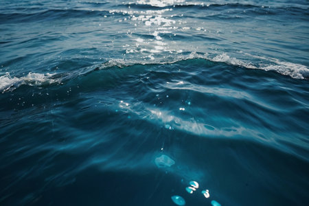 Blue sea water surface texture background. Closeup of blue sea water surfaceの素材