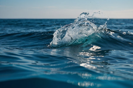 Water splashes on the surface of the sea. Shallow depth of fieldの素材