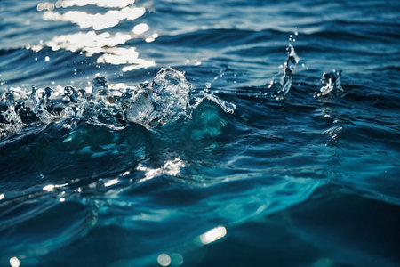 Water splashes on the surface of the sea. Shallow depth of fieldの素材