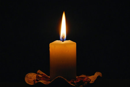 candlelight on black background, closeup of photo with shallow depth of fieldの素材