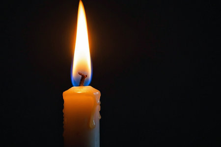 candle flame on a black background with copy space for your textの素材