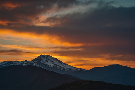 Sunset in the mountains with snow-capped peaks of the Caucasusの素材