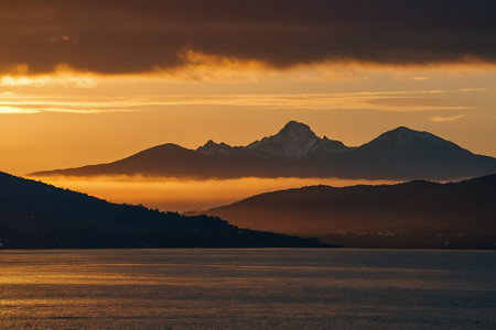 Sunset over Lake Garda, Italy. View of the mountains in the background.の素材