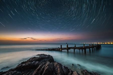 Beautiful starry sky over the sea at sunset. Long exposureの素材