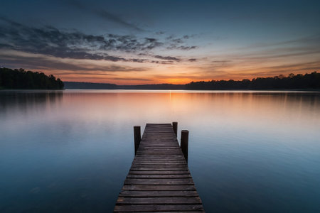 Wooden pier on the lake at sunset. Beautiful summer landscape.の素材