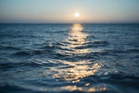 Sunset on the sea. The sun is reflected in the water.の素材