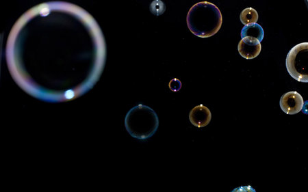 Soap bubbles on a black background. Close-up shot.