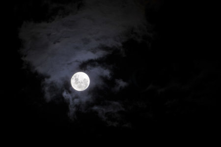 Full moon in the night sky with clouds. (with clipping path)