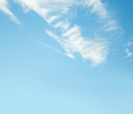 blue sky background with white clouds, soft focus and copy space.の写真素材