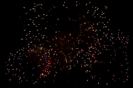 Colorful fireworks in the night sky as an abstract background. Texture