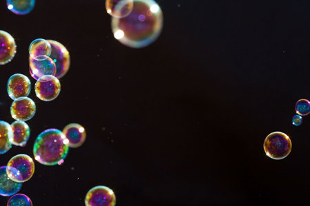 Soap bubbles on a black background. Shallow depth of field.の写真素材