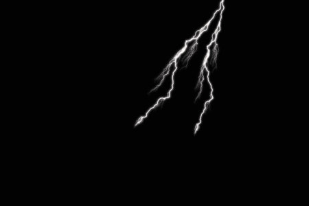 Lightning strike on a black background. Isolated lightning strike on black background.の写真素材