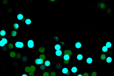 Abstract circular bokeh background of Christmaslight. Green and blueの写真素材