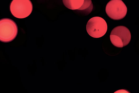 Abstract circular bokeh background of Christmaslight on black background.の写真素材
