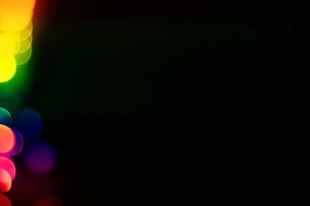 Colorful bokeh light on black background. Abstract background.の写真素材