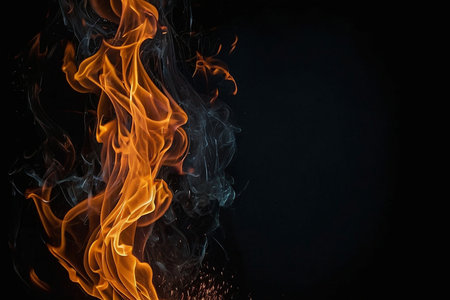 Fire flames isolated on black background with copy space for your text.