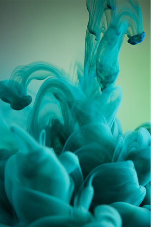 Abstract and very colorful motion blur background of ink drop in water.の写真素材