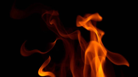 Fire flames isolated on black background. Abstract background. Texture of fire.
