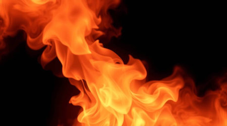 Fire flames on a black background. Texture of fire for design.の写真素材