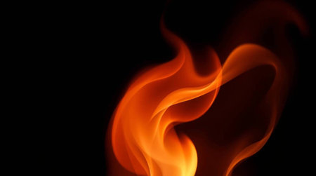 Fire flames isolated on black background with copy space for your text.の写真素材