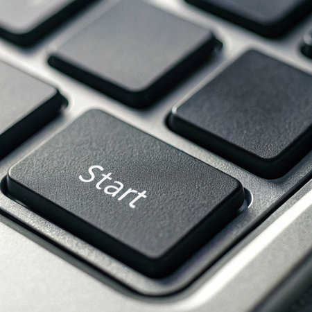 Close up of a computer keyboard with start button, business success conceptの写真素材