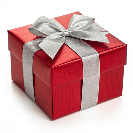 Red gift box with silver ribbon bow isolated on white background, clipping path includedの写真素材