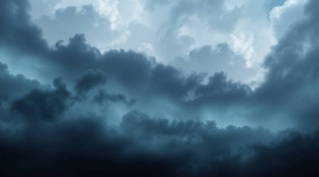 Dramatic dark stormy sky with glowing clouds. Abstract backgroundの写真素材
