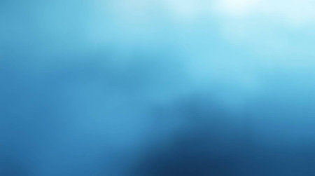 blue abstract background with some smooth lines in it and some spots on itの写真素材