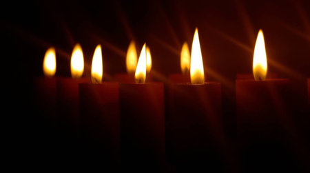 Burning candles in the dark. Candles on a dark background.の写真素材