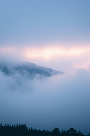 Fog in the mountains at dawn. Beautiful landscape in the mountains.の写真素材