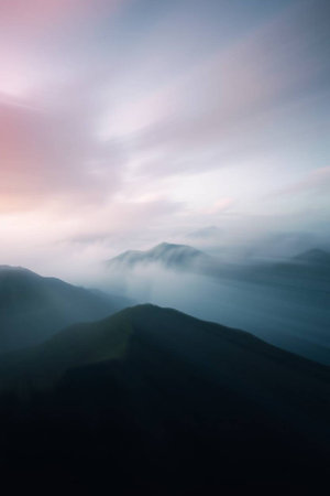 beautiful mountain landscape with fog in the morning. long exposure shotの写真素材