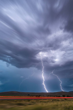 Stormy sky with lightning strikes in a rural area of Montana.の写真素材