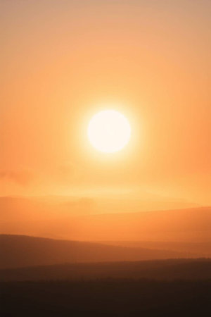 beautiful sunset in the mountains in the fog, closeup of photoの写真素材
