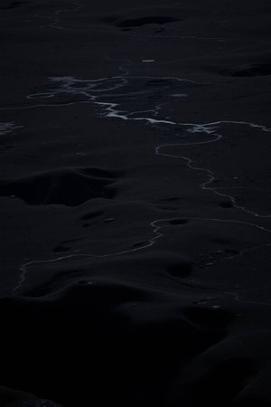 Black sand background. Black sand texture. Abstract black sand background.の写真素材