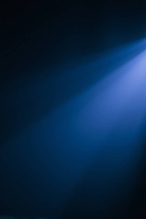 Blue light beam on dark background. Light beam on dark background.の写真素材