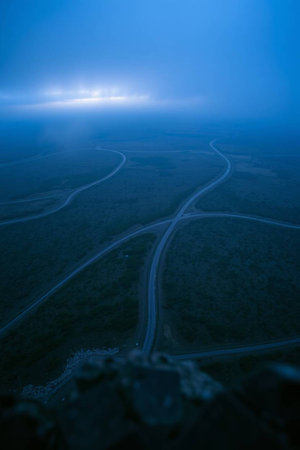 High angle view of a road in the middle of a foggy fieldの写真素材