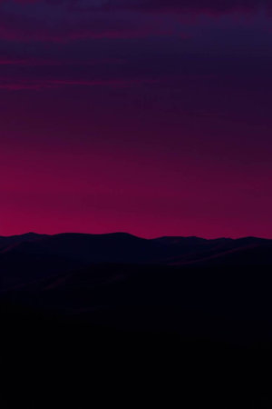 Silhouette of a mountain range at sunset. Beautiful landscape.の写真素材
