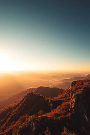 Mountain landscape with misty sunrise. View from the top of the mountain.の写真素材